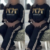 ست تیشرت و شلوار زنانه جنس پنبه گلکسی رنگ مشکی فری سایز آرتینا